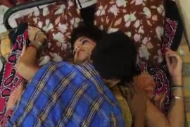 Dirty old lady is licking her own pussy.